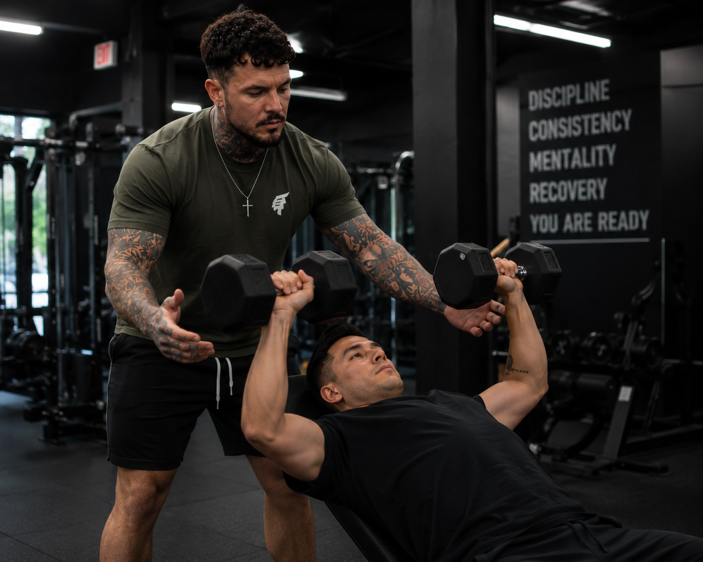 Dave coaching client on a bench press